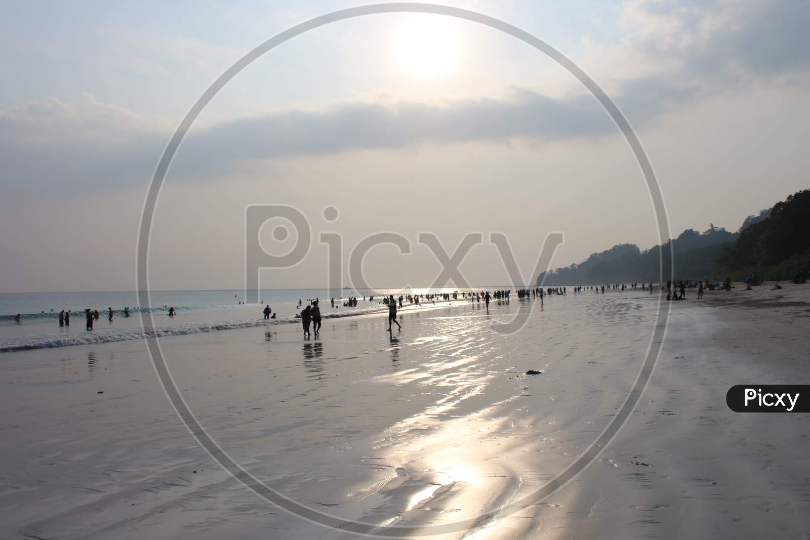 tourist having fun time at Radhanagar Beach, Havelock Island