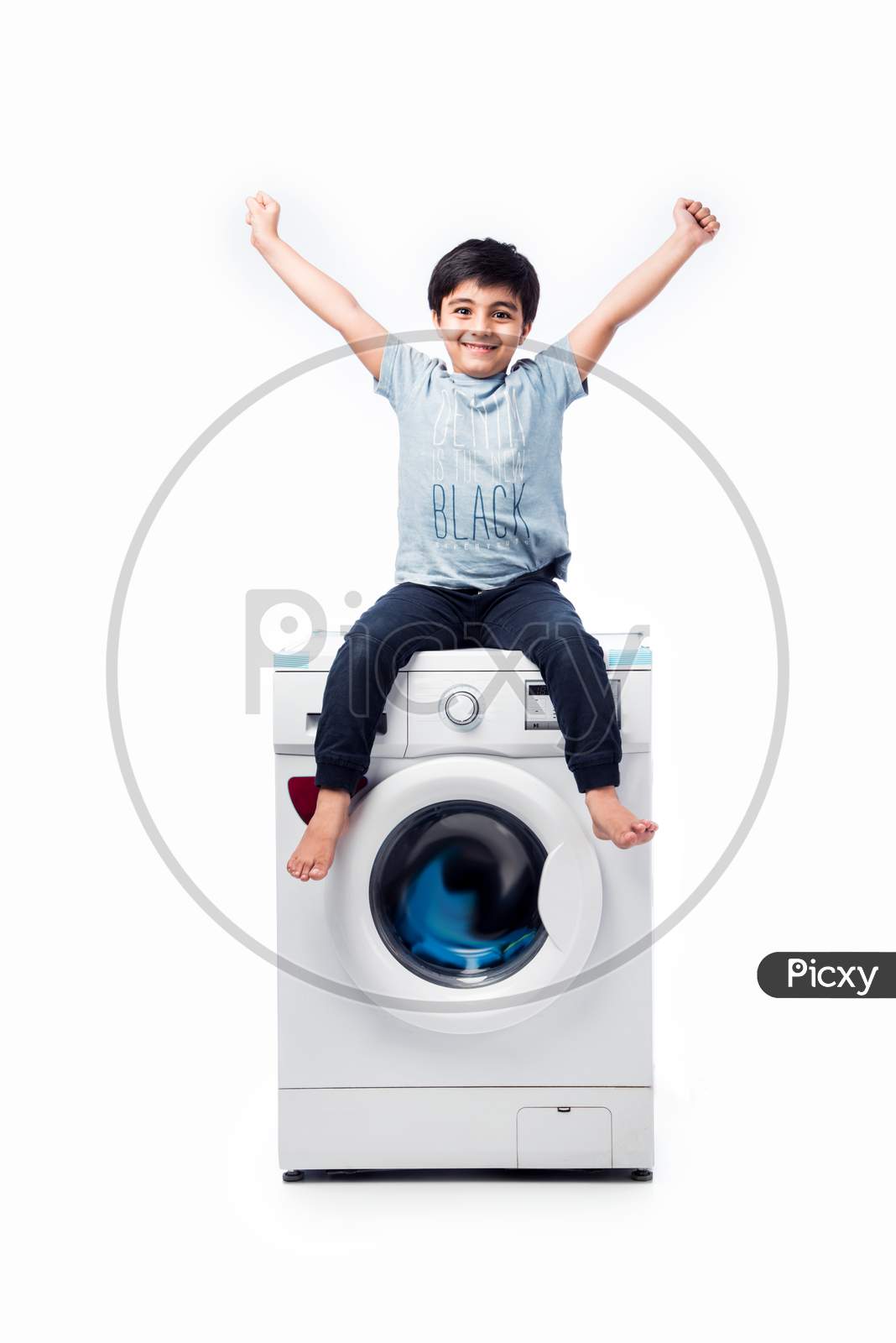 Indian Small Boy Presenting Dish Washer Or Washing Machine