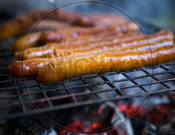 Delicious Sausages Are Grilled And Ready To Be Served To Guests.