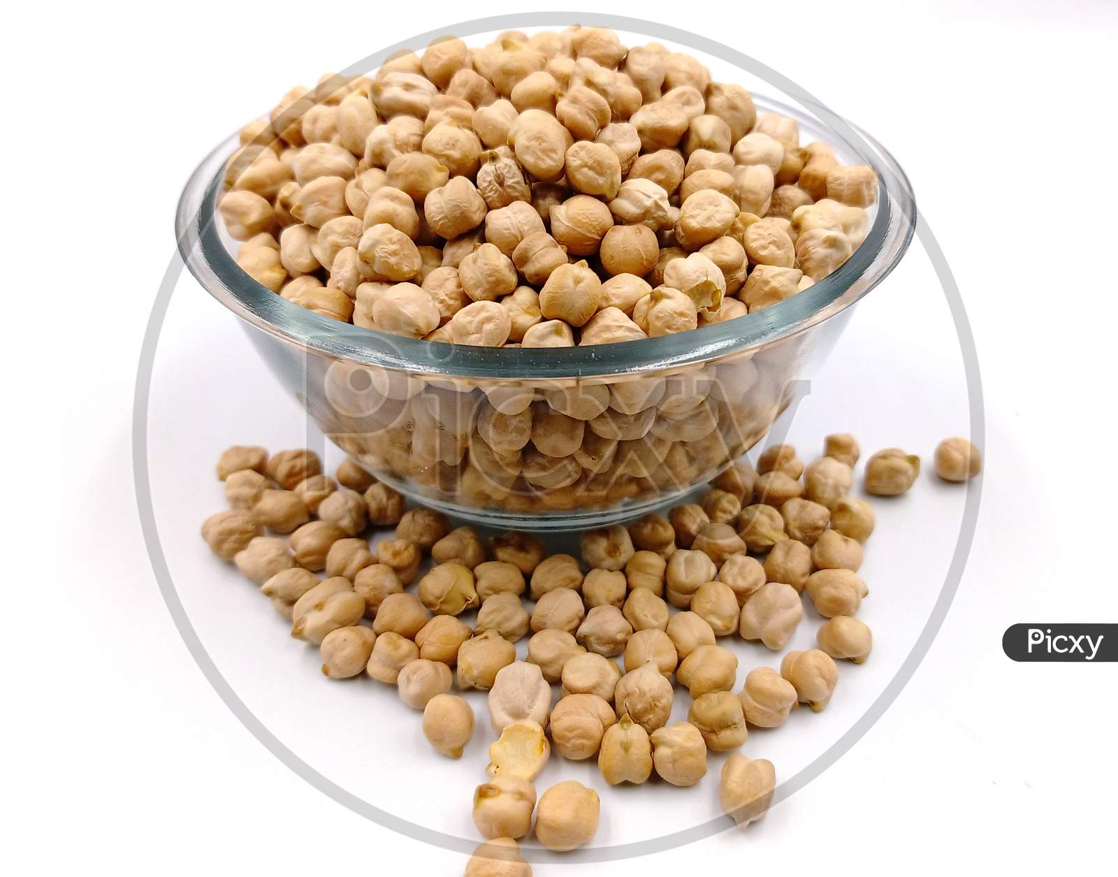 chickpeas in glass bowl on white background