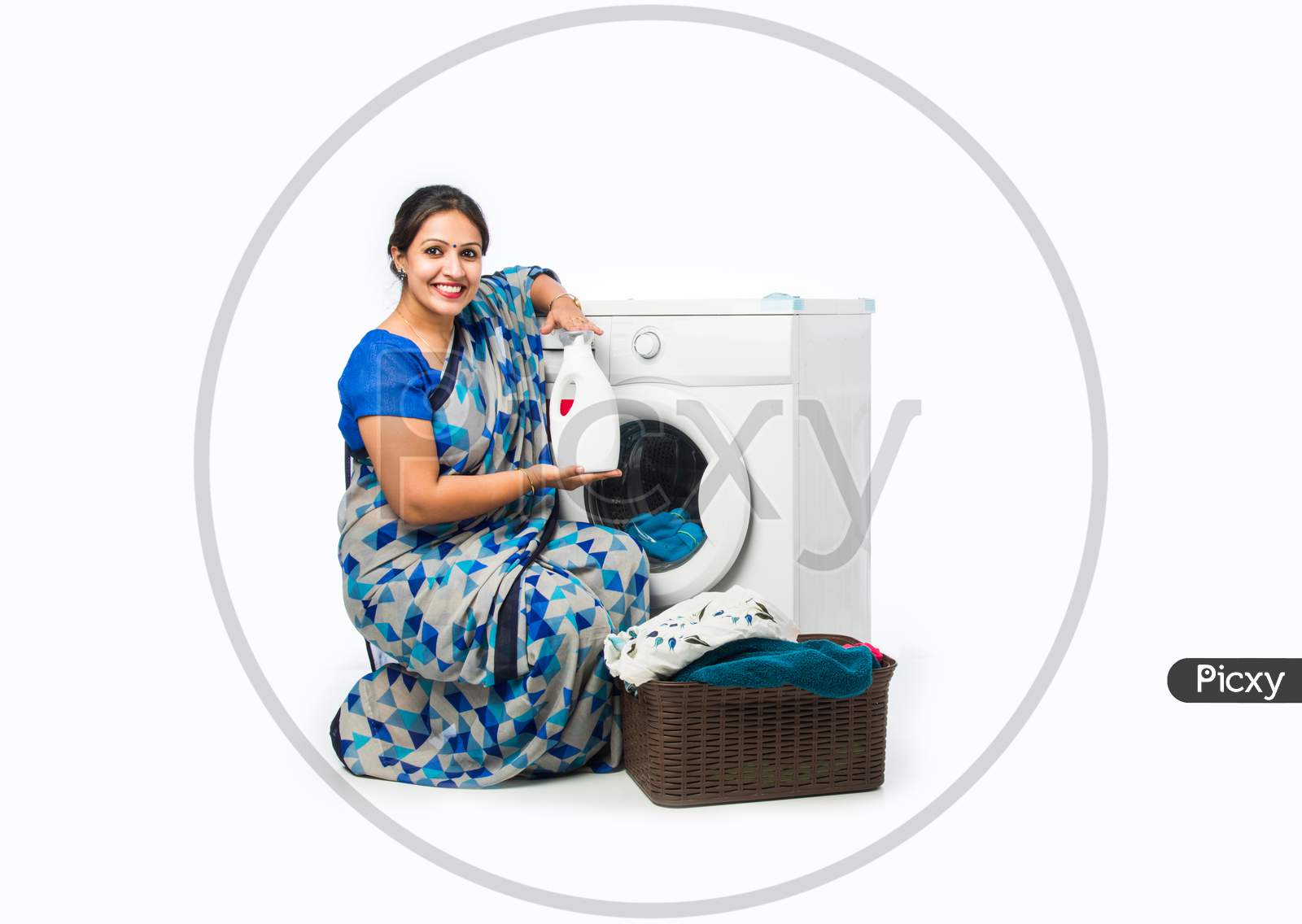 Indian Asian Housewife Washing Cloths In A Machine