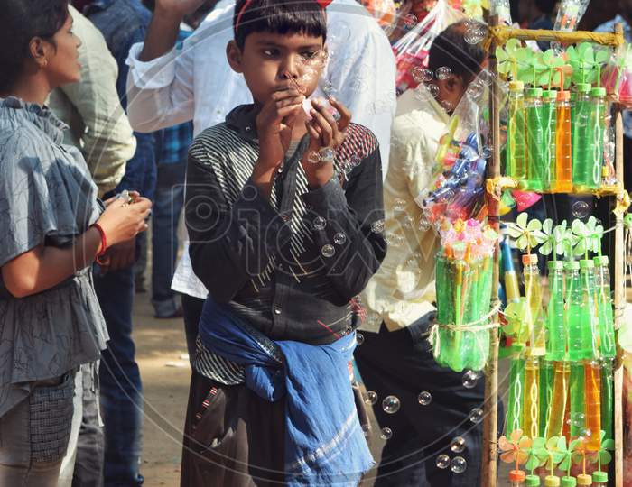 Young boy selling goods