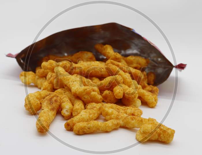 Healthy crunchy snack,Kurkure snack,Evening Snack or the Tea Snack,Kurkure is an evening snack that is manufactured using edible ingredients like rice meal, Background Texture with wrapper.