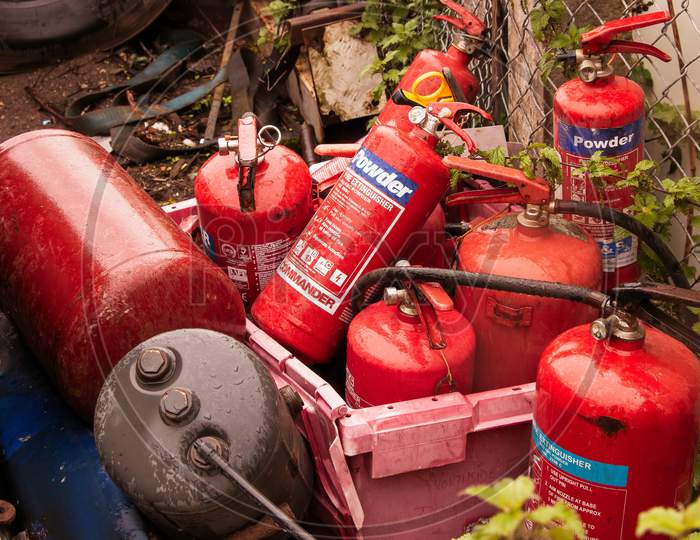 Many Red Fire Extinguishers In Box In Truck Lorry Yard