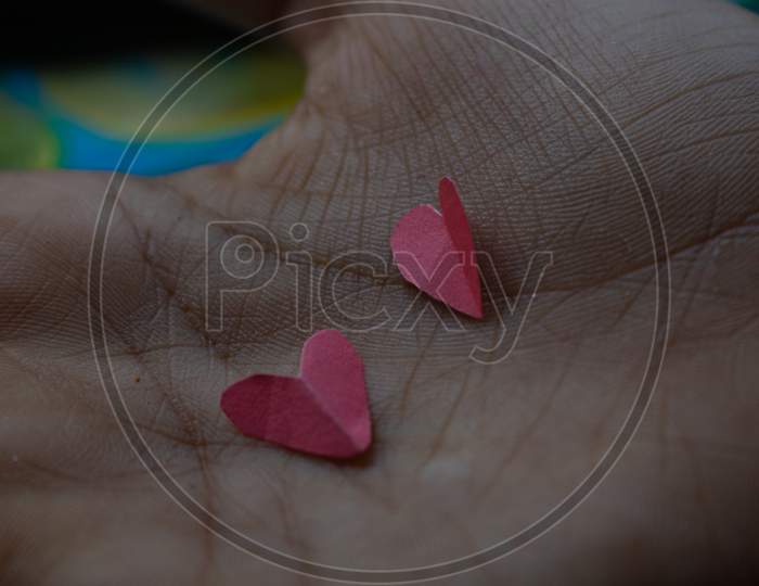 A Person Holding Red Heart In Hands, Donate And Family Insurance Concept, On Aquamarine Background, Copy Space Top View