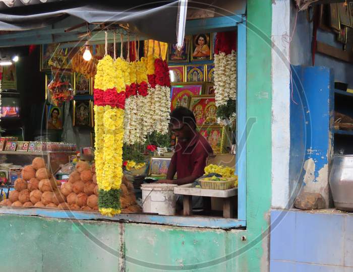 Shopkeepers And Street Shop Selling Flower Garlands