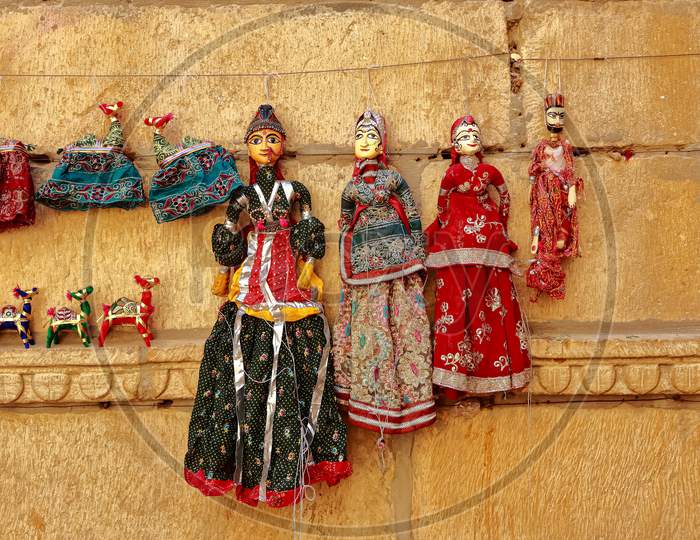 Colorful human shaped Puppets wearing colorful clothes