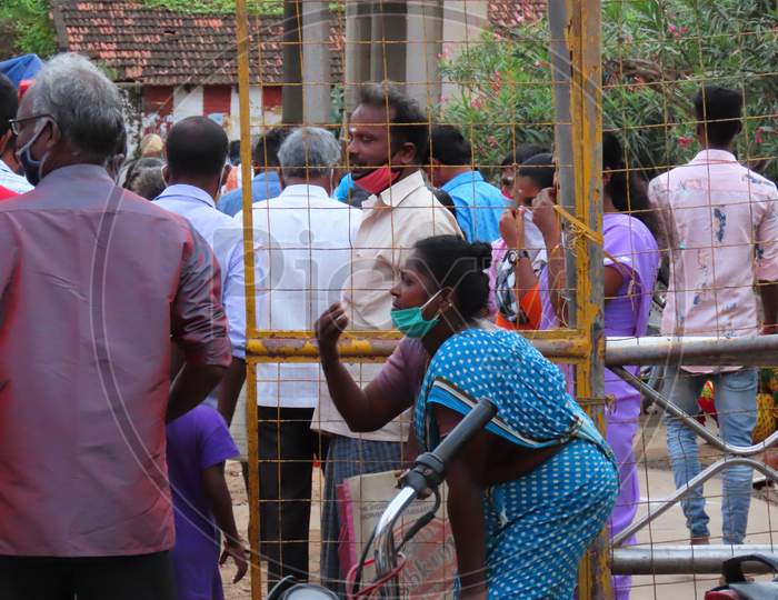 A Poor Woman Wearing A Mask To Protect The Corona At The Hindu Temple Entrance, Begging People To Eat Something Or Begging