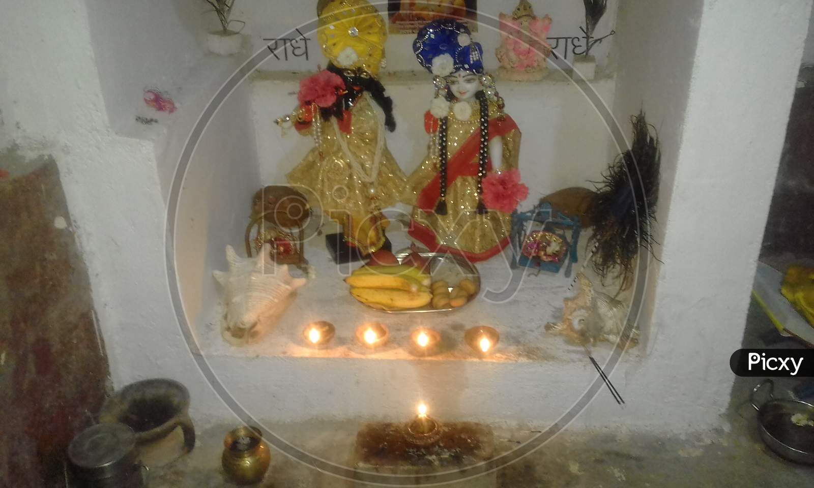 radhakrishna worship by oil lamp