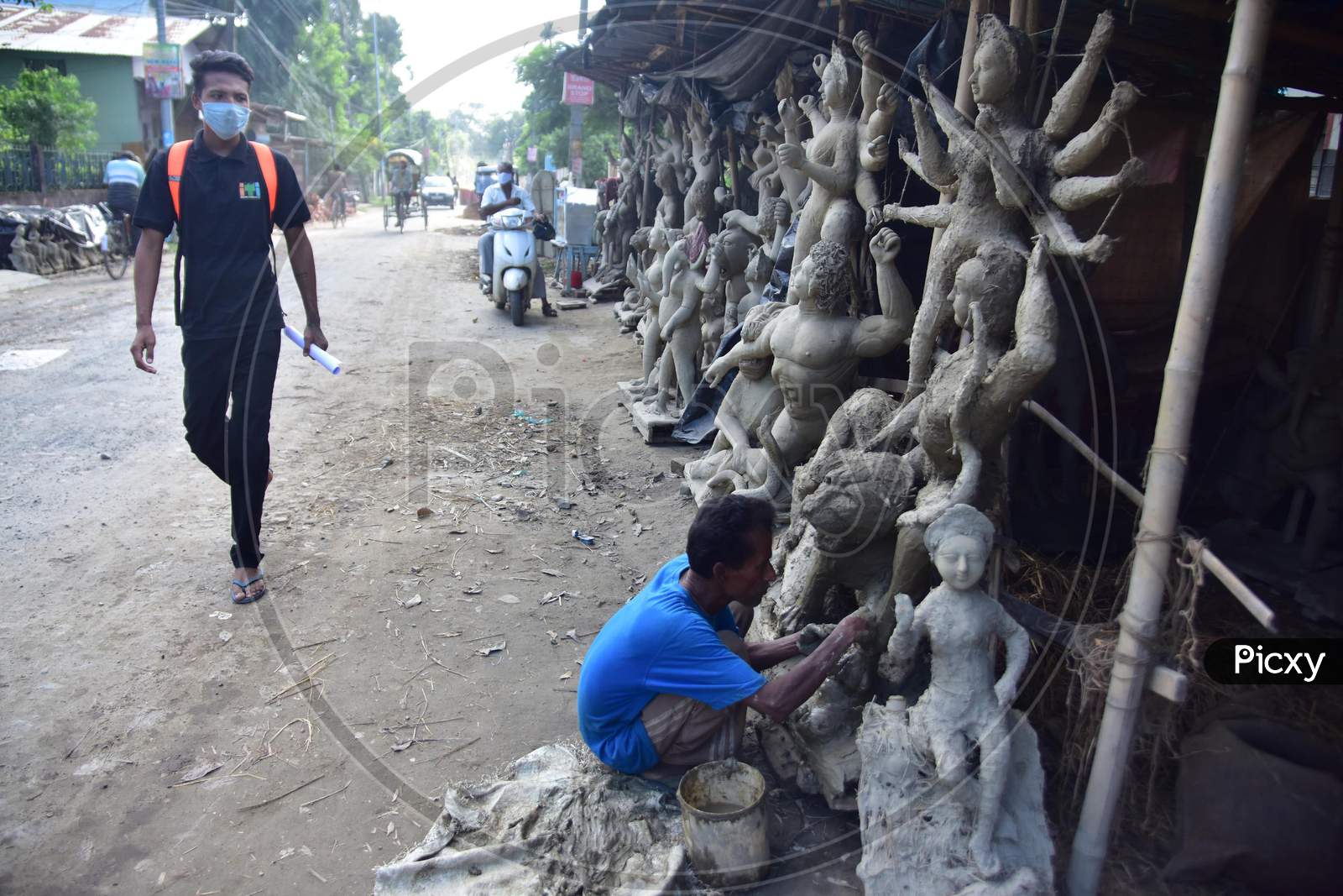 Durga idol is being prepared by an artist ahead of the biggest Hindu festival Durga puja in Nagaon District of Assam on Oct 9,2020