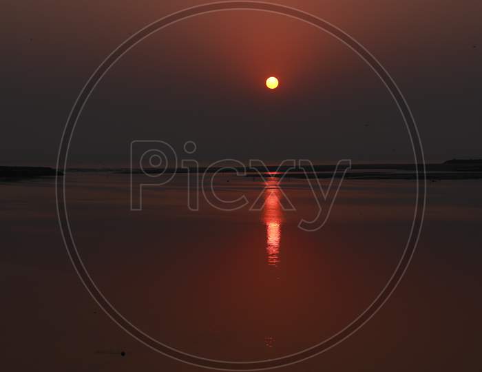 Landscape Photography, Morning Sunrise At Beach With Round Full Sun