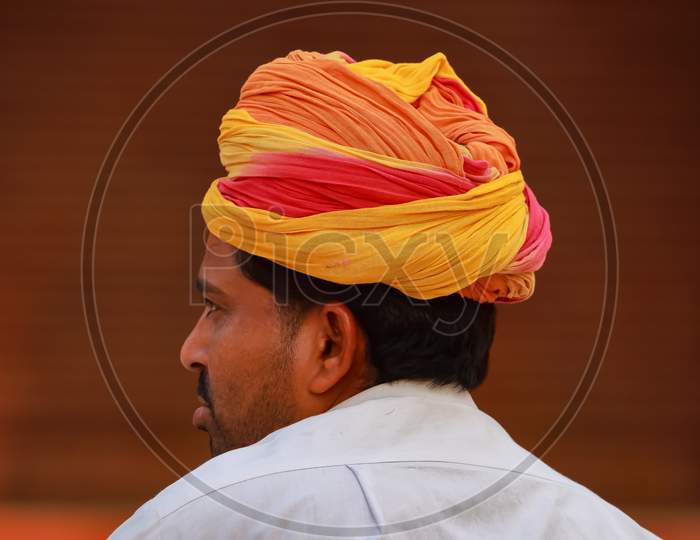 Abstract side portrait of a Rajasthani man wearing a colorful turban
