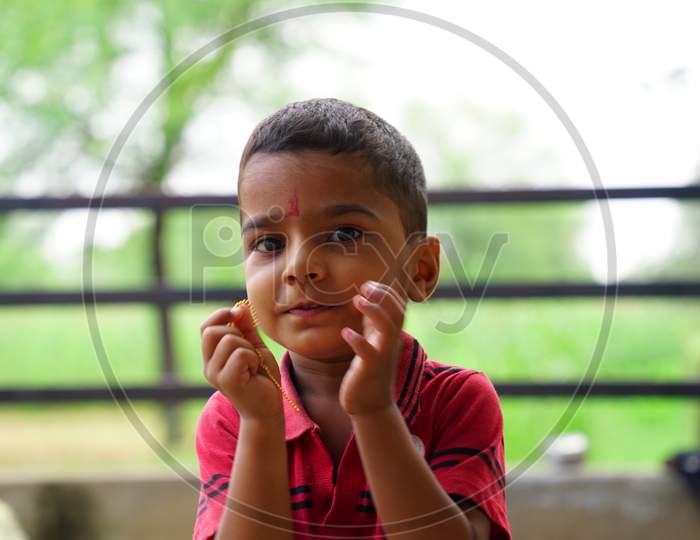 Indian School Boy Posing To Camera.