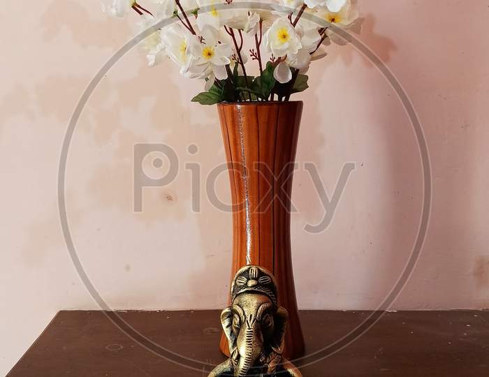 artificial flower pot with ganesh ji