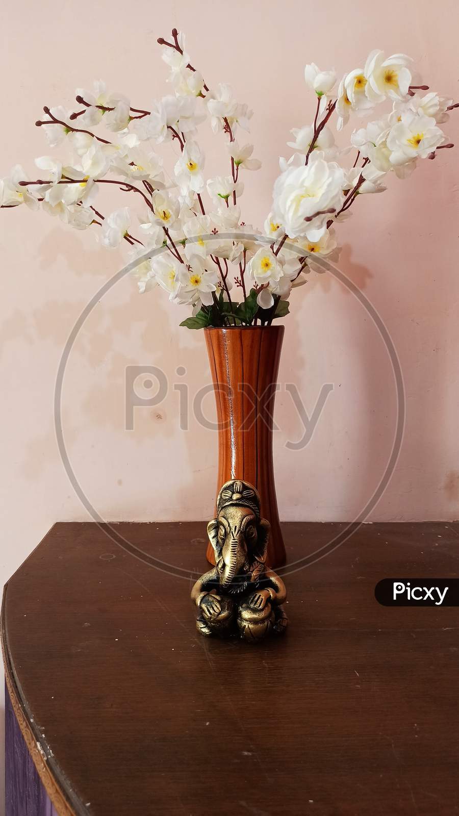 artificial flower pot with ganesh ji