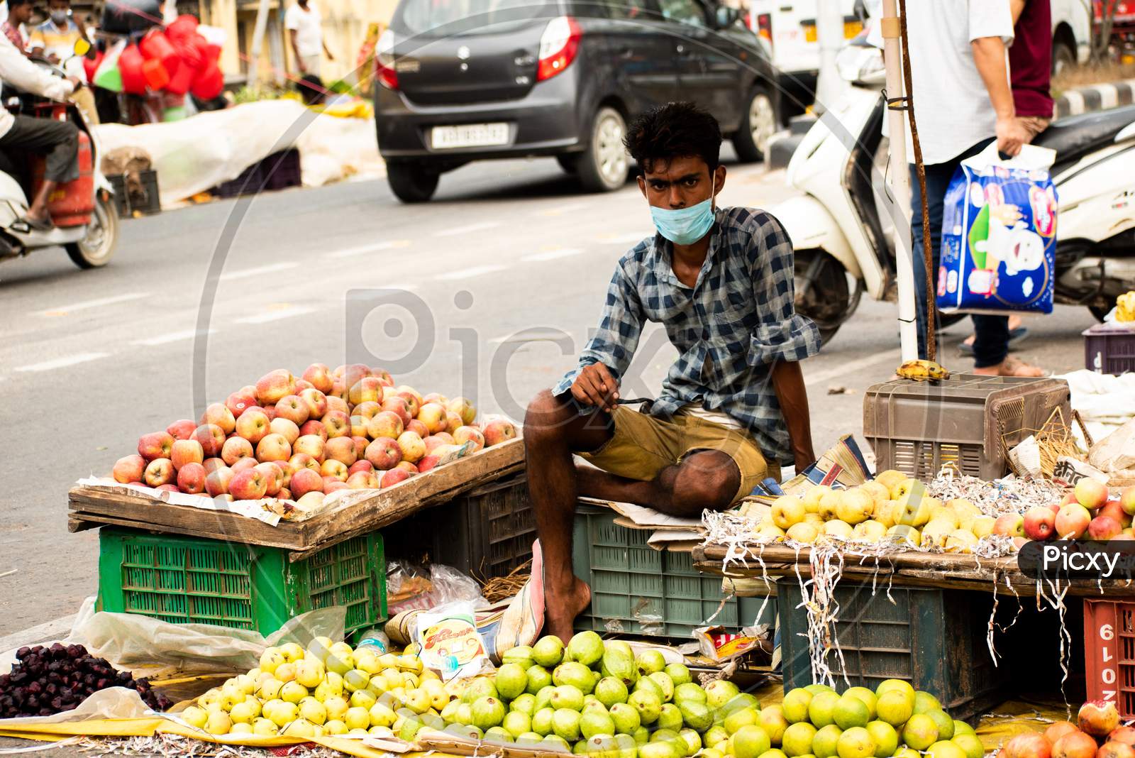 An unidentified vendor selling vegetables in weekly market