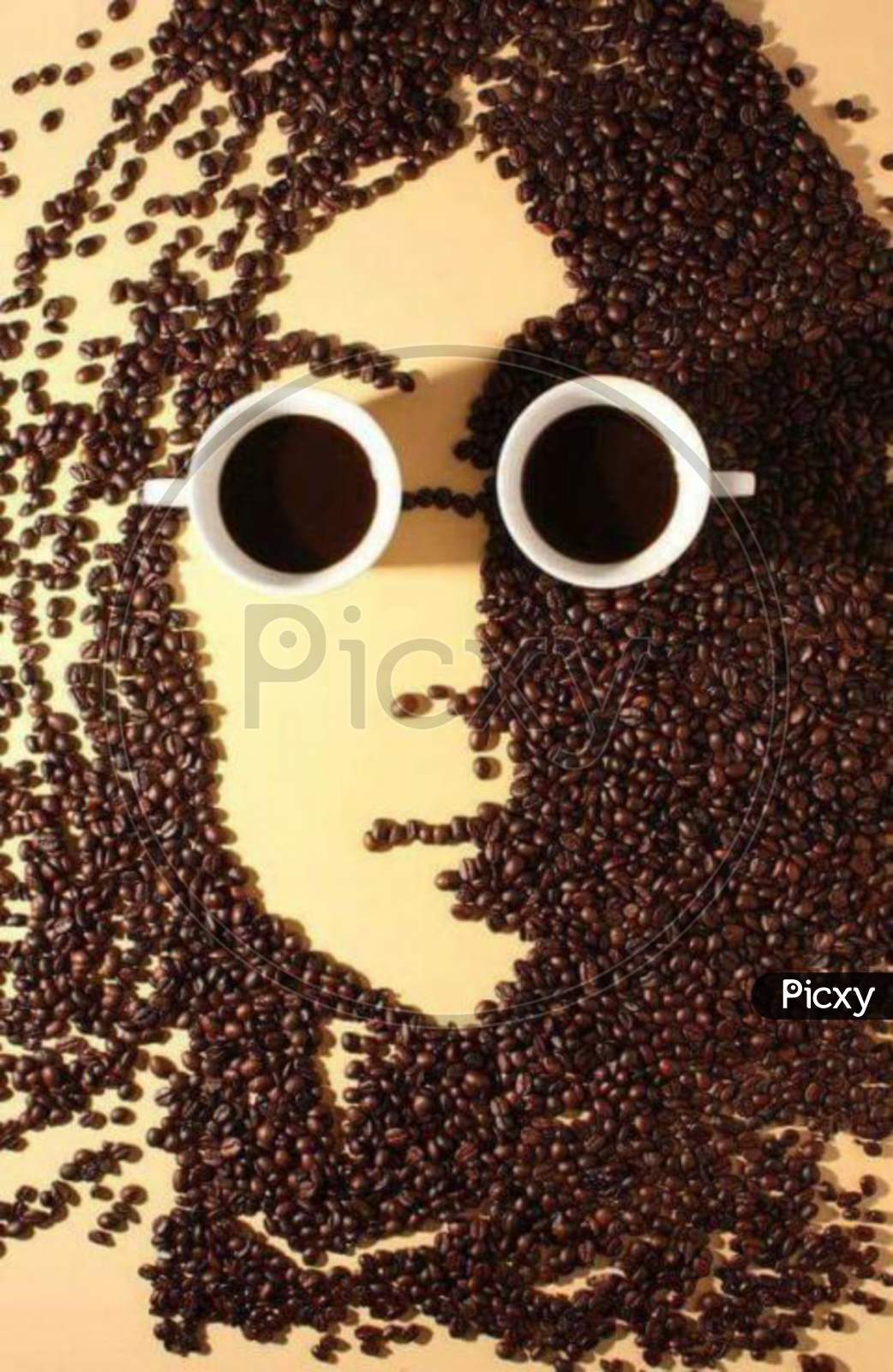 Coffee beans Art , Mans face in coffee beans and coffee mugs