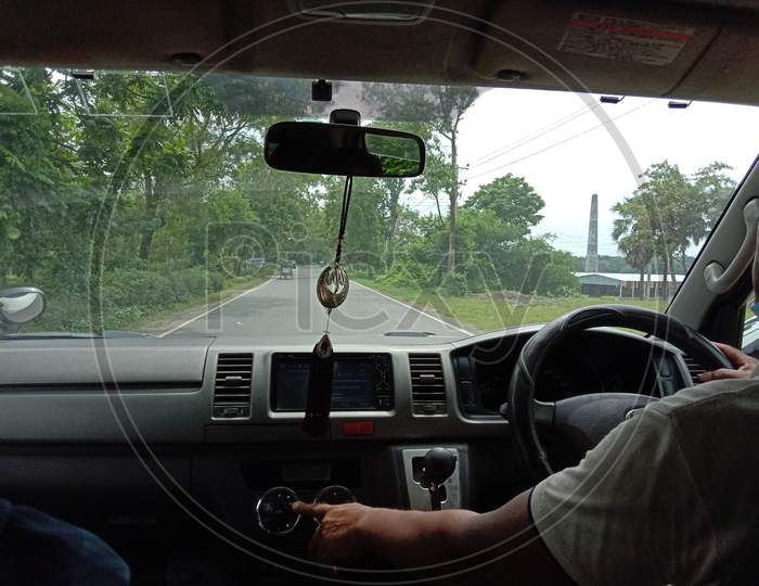 Dashboard View Of Car With Driver