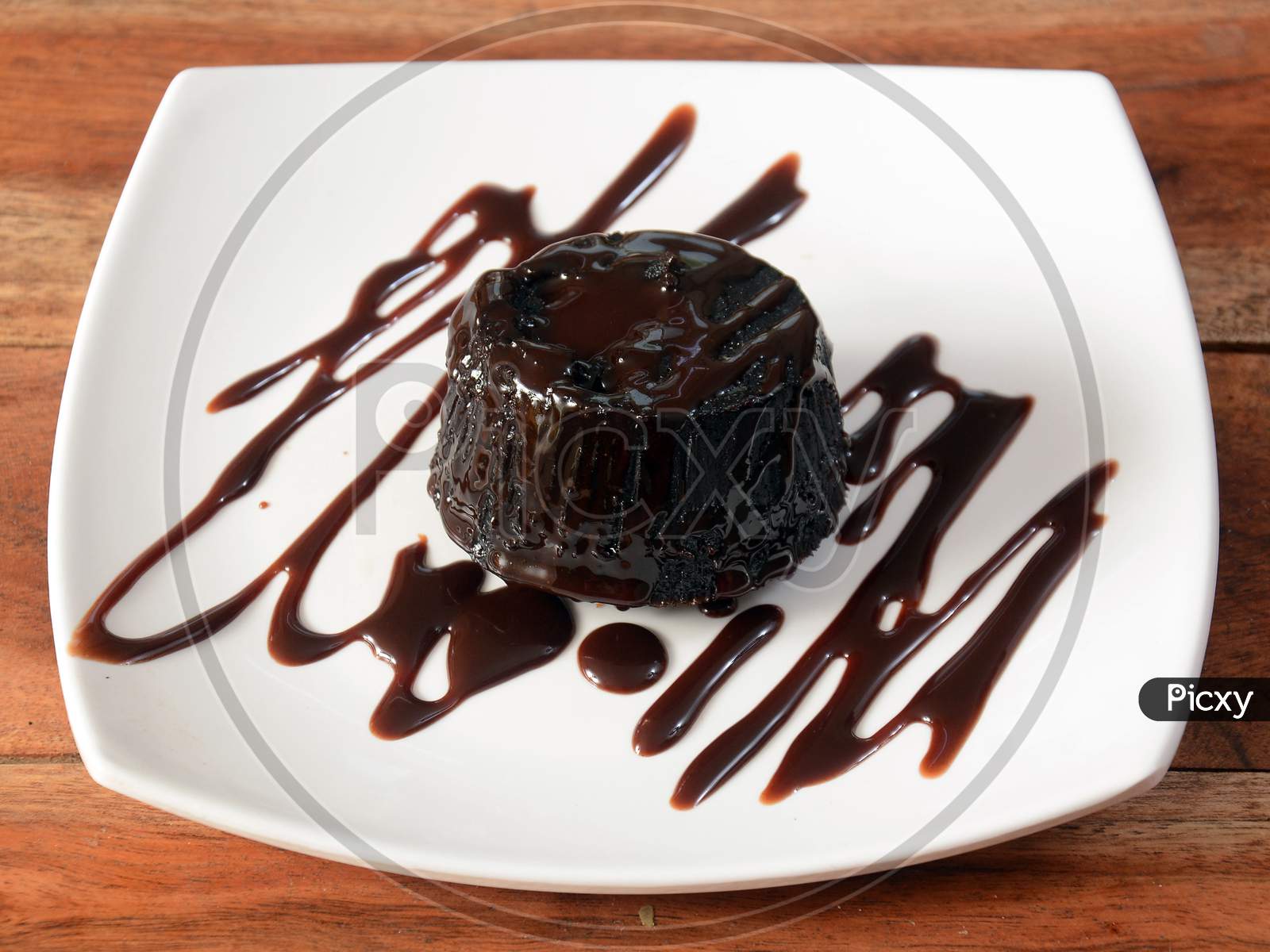 Plate Of Delicious Fresh Oreo Lava Cake With Hot Chocolate On White Plate