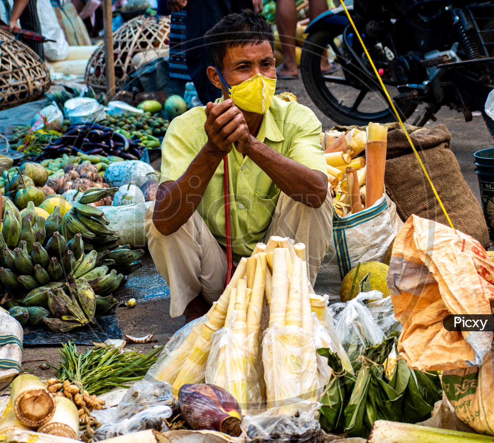 An unidentified vendor selling vegetables