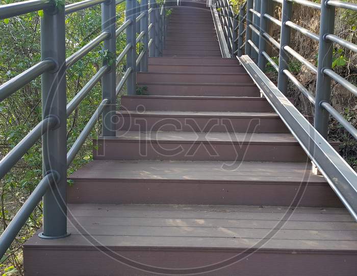 Wooden Stairs With Handrails On Both Sides