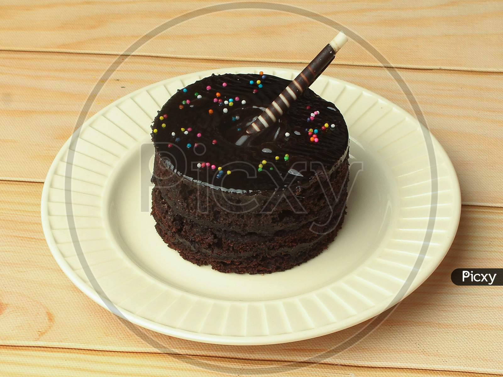 Tasty Dark Chocolate Cake On White Plate For Birthday Celebration