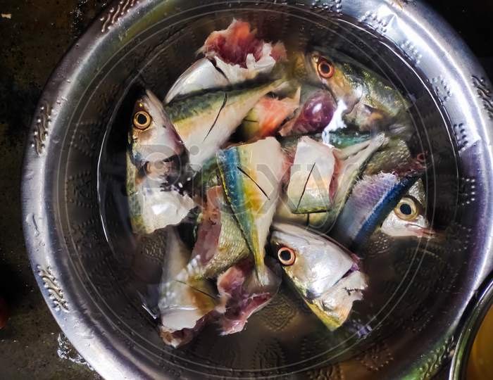 Fresh Raw Chopped Fish In Steel Bowl On Close-Up . Chopped Raw Fish In Home For Lunch . Making Of Seafood Meal.