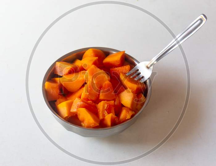 Papaya Cut Pieces In A Bowl With Fork