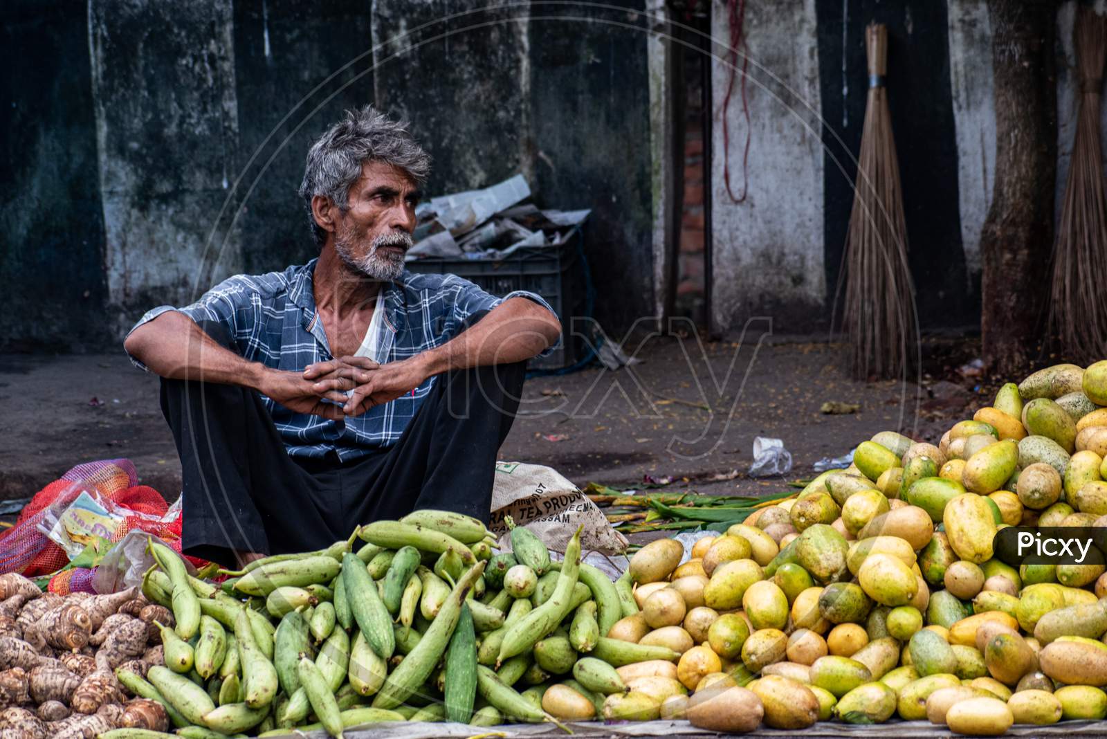 An unidentified vendor selling vegetables
