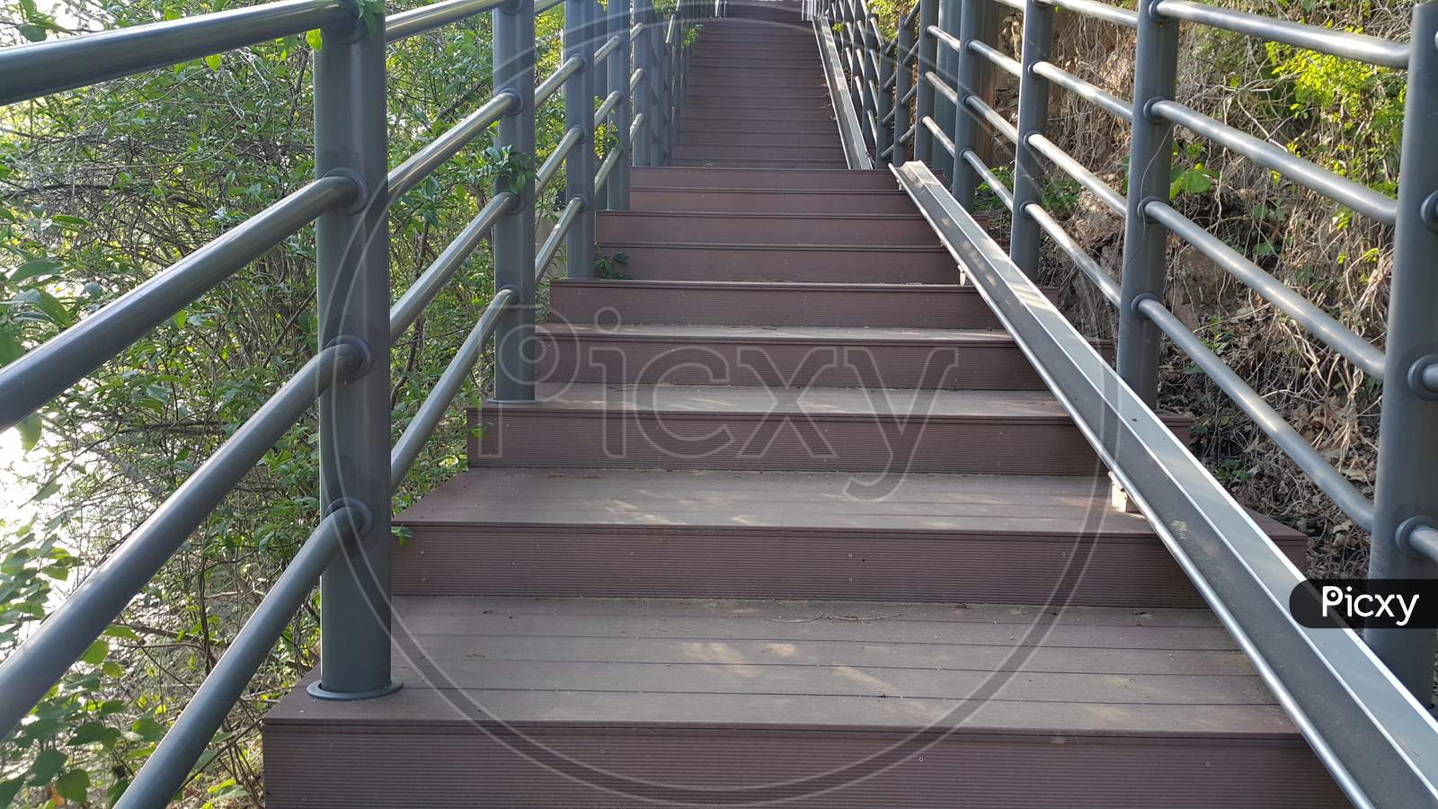 Wooden Stairs With Handrails On Both Sides