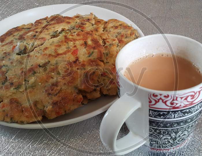 Closeup View Of Of Traditional Bread Called Jawar Roti Or Bhakri With Tea Cup