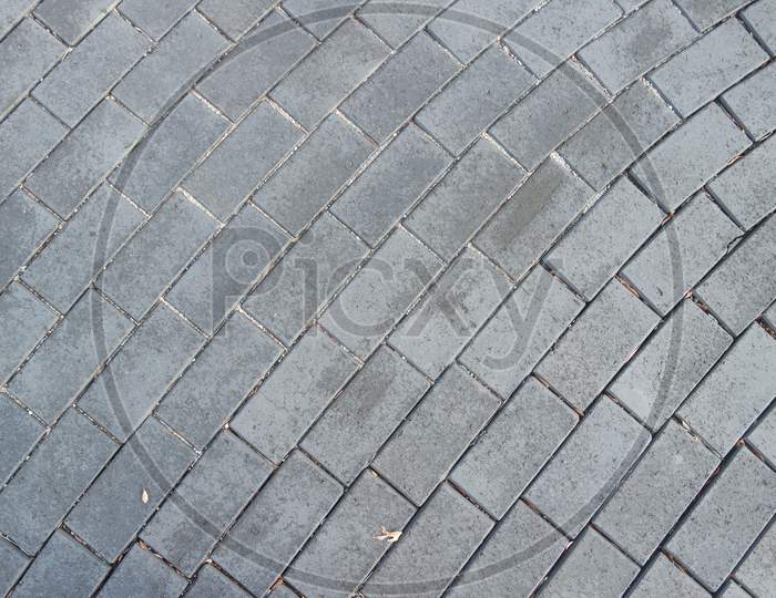 A Background Of A Weathered Old Exterior Brick Floor