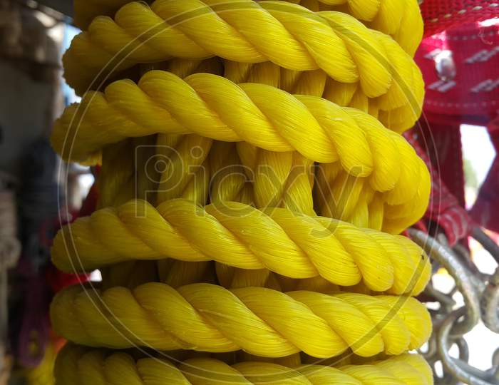 Hanks Or Coil Of Bright Colored Plastic Rope Interwoven
