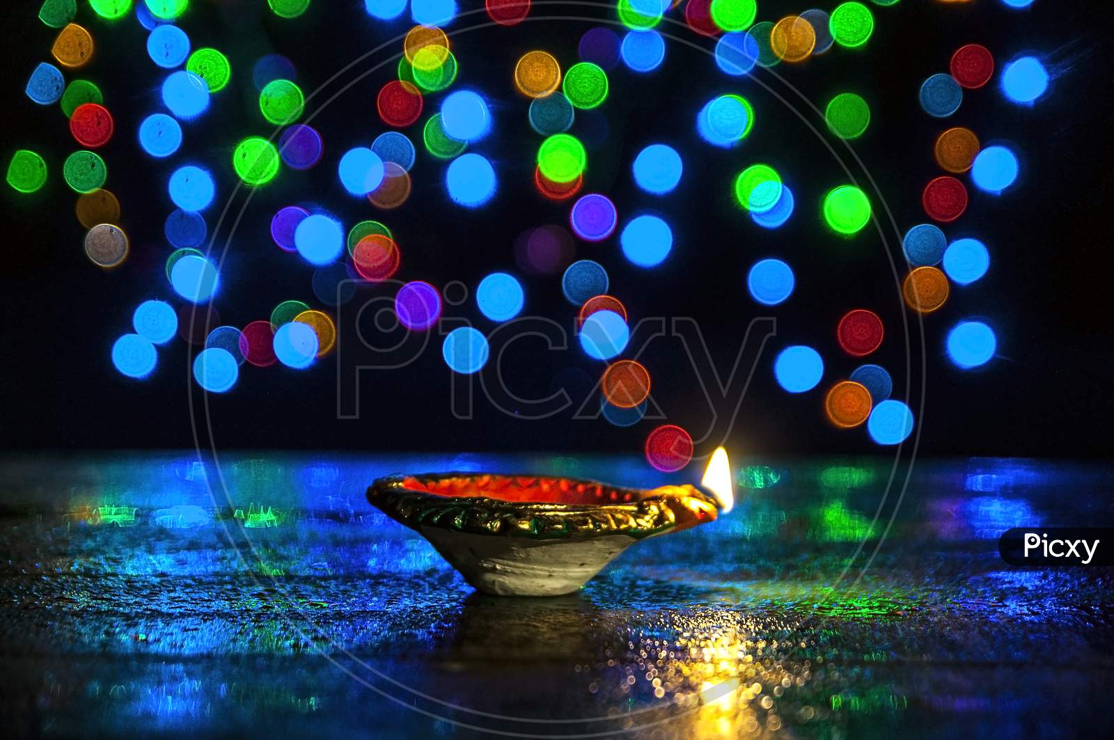 The multi colored Diwali lights with diya.