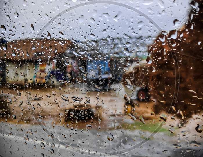 scenery through rainy windshield