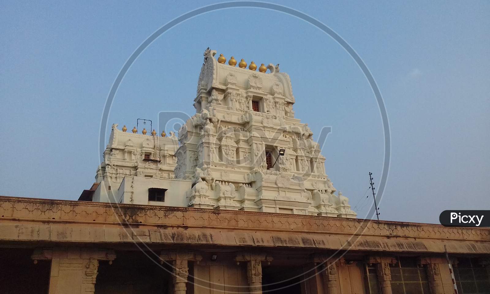 Shri Rang Nath Ji Temple, Vrindavan Ancient sri krisna balaram temple in Vrindavan wit golden pole. te temple design is sout indian type.
