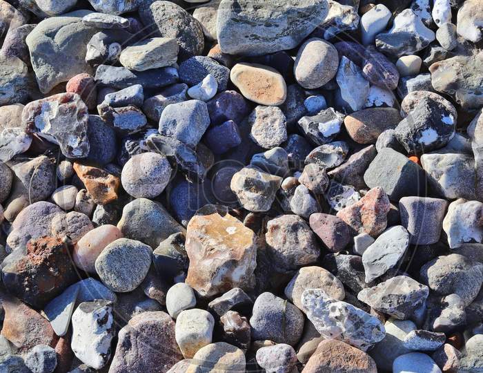 Photo Realistic Seamless Texture Pattern Of Pebbles And Stones At A Beach