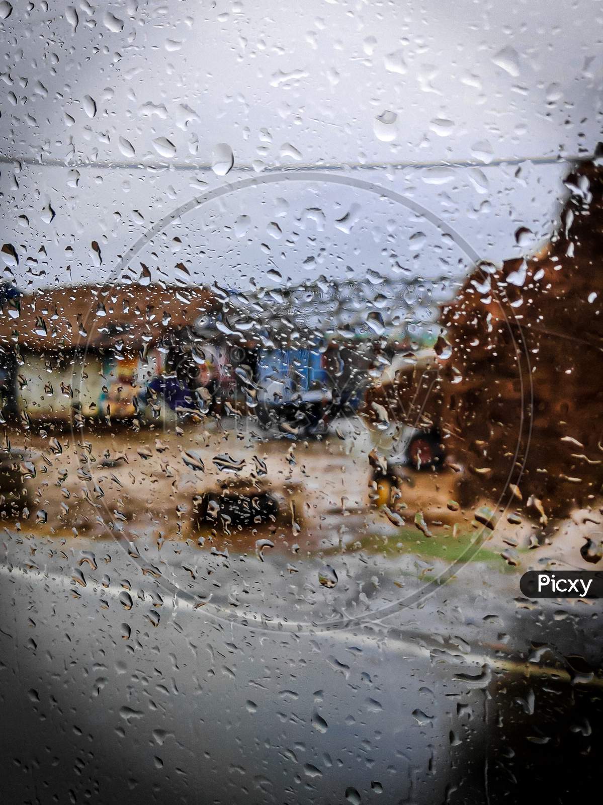 scenery through rainy windshield