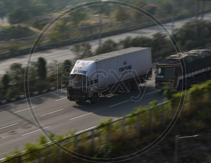 Fast moving container lorry on a Highway.