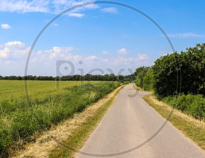 Beautiful View On Countryside Roads With Fields And Trees In Northern Europe