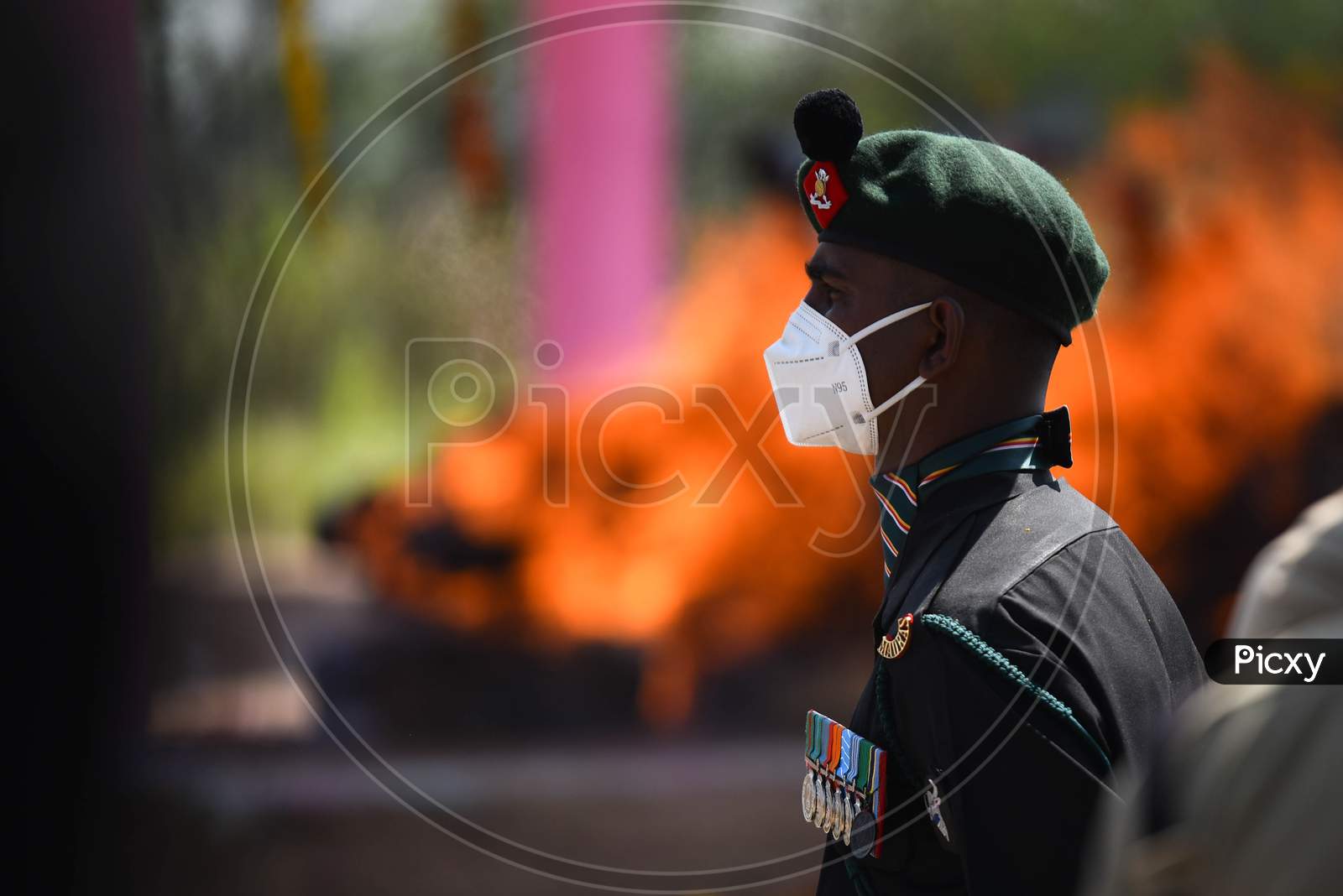 A soldier stands guard at the funeral of soldier Ryada Mahesh, 26, from Telangana's Nizamabad district, who was martyred in the encounter along with three others at Machil sector of Kupwara district in Jammu and Kashmir on Sunday.