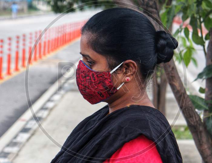 A woman wearing a mask