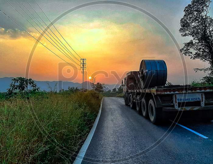 Lorry Truck on road during morning sunshine