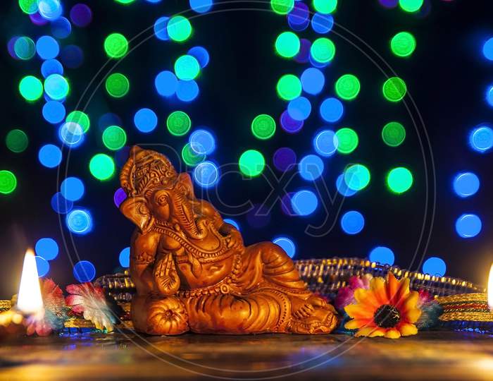 Lord Ganesha with multicolored festive lights.