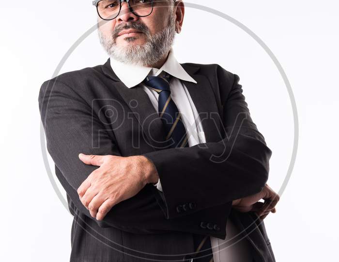 Portrait Of Indian Asian Thoughtful Senior Businessman In Suit