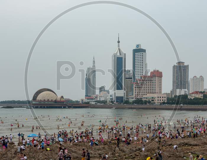 People Bathing At The Qingdao City Beach, Shandong Province, China