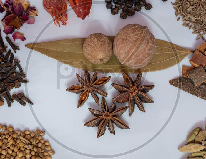Different Spices And Herbs In A Plate, Close Up, Top View. Assortment Colorful Spices, Seeds And Herbs For Cooking Biriyani.