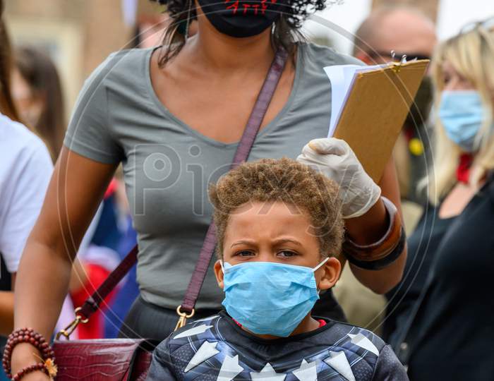 Strong Female Leader Wears Black Lives Matter Ppe Face Mask And Hugs Superhero Son At Blm Protest In Richmond, North Yorkshire