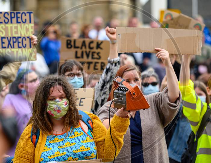 British Blm Protesters Wear Ppe Face Masks And Hold Homemade Signs At Black Lives Matter Protest In Richmond, North Yorkshire