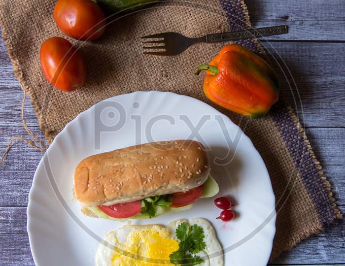 Delicious breakfast with fried eggs and vegetables in a plate